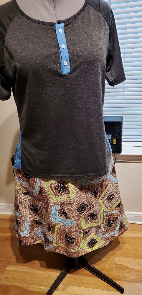 Matching set. Charcoal grey, turquoise top ; multi- color Skirt  is lined.